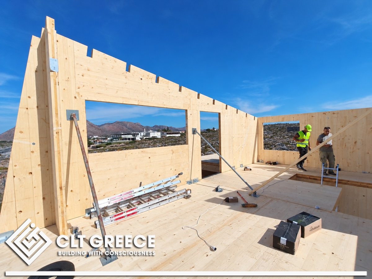 CLT walls with large openings framing the hills of Chania
