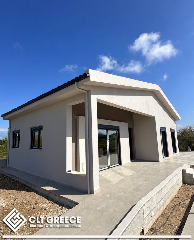 The completed single-storey CLT house in Preveza with its external insulation