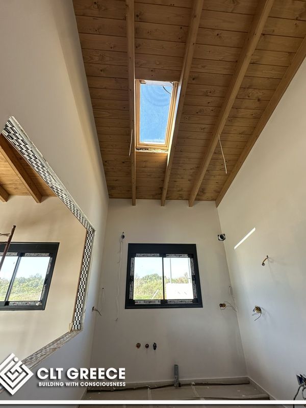 Inside the CLT house in Preveza with its exposed timber ceiling (1)