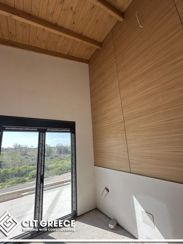 Inside the CLT house in Preveza with its exposed timber ceiling (7)