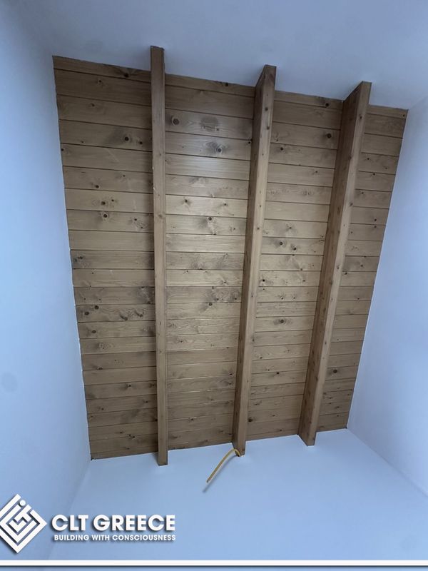 Inside the CLT house in Preveza with its exposed timber ceiling (8)