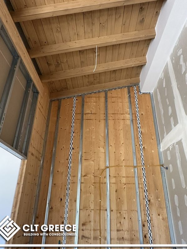 Inside the CLT house in Preveza with its exposed timber ceiling (11)