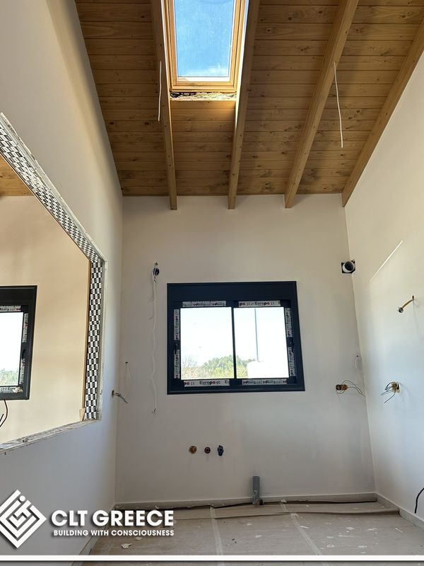 Inside the CLT house in Preveza with its exposed timber ceiling (13)