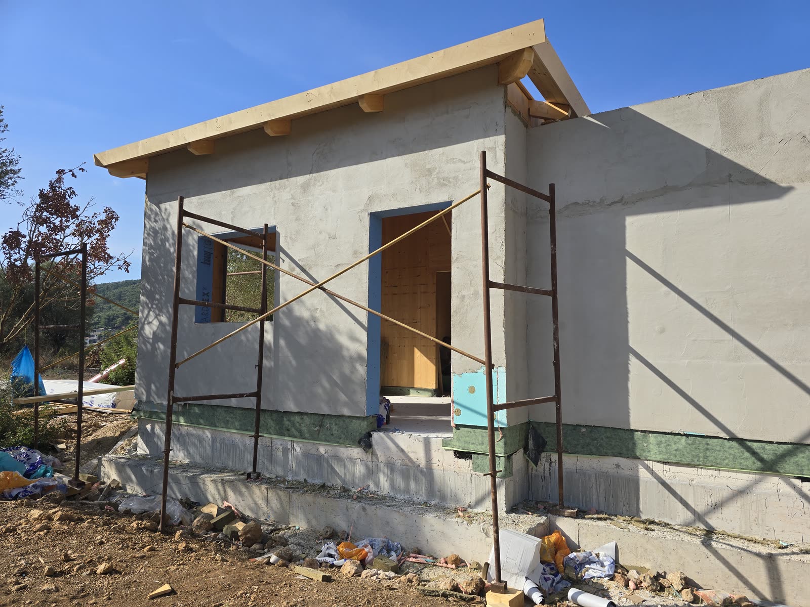 The CLT house in Vasiliki, Lefkada with the roof completed and external insulation on the facades